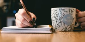 journal and coffee - How to Become a Freelance Writer With No Experience