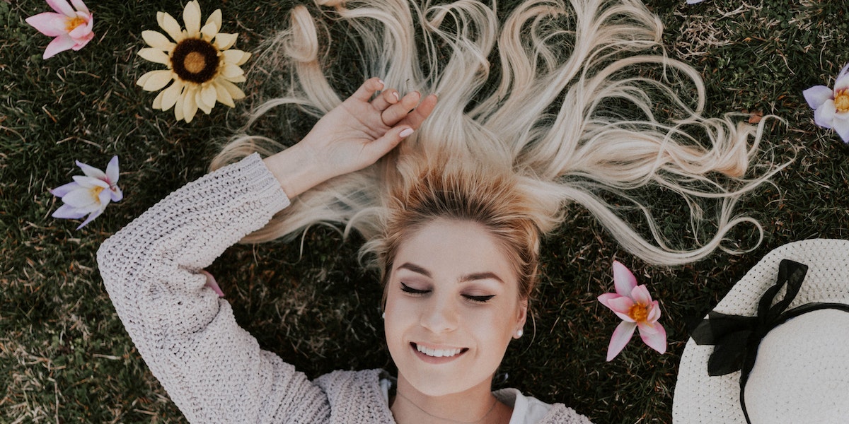 attraction works - woman lying in field