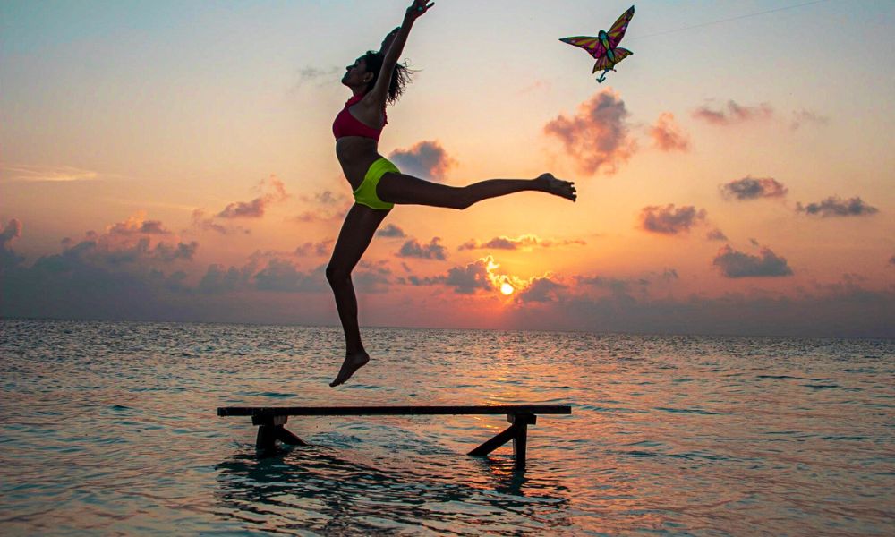 somatic meditation - woman jumping in water